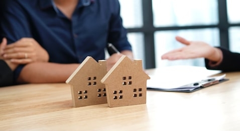 loan,contract, debt and residential investment concept. contract of loan and estate agreement for investor or buyer to sign for getting approval form the bank.   