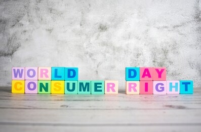 "world consumer right day "-the words on wooden cubes.  a background image of english words on colorful building blocks.