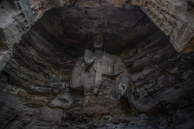 big buddha in yungang grottoes, datong city, shanxi province, china
