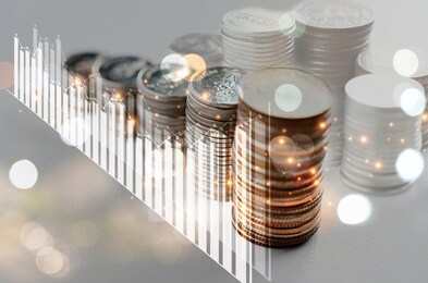 double exposure money coin stack with graph background concept business finance