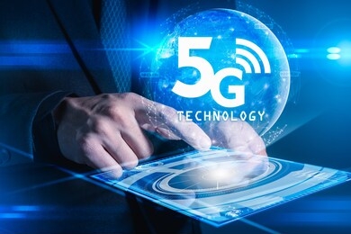 the abstract image of businessman using a smartphone overlay with 5g and cityscape hologram. the concept of 5g, communication, network, connection, internet of things.
