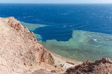 blue hole is a popular diving location on east sinai, a few kilometres north of dahab, egypt on the coast of the red sea.