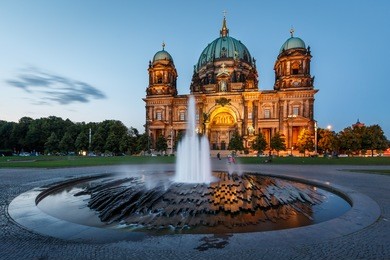berlin cathedral (berliner dom) and fountain illuminated in the evening, germany