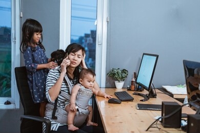 stress mother while working from home and babysitting her children