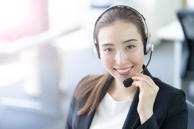 portrait of business person wearing headset working