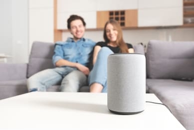 couple talking command to smart speaker. intelligent assistant in smart home system.