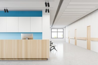 wooden reception desk with computer standing in stylish hospital hall with white and blue walls and row of closed doors and visitors chairs. concept of healthcare and medicine. 3d rendering