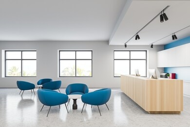 comfortable blue armchairs and wooden reception desk standing in modern hospital hall with white and blue walls and windows with blurry tropical view. concept of healthcare. 3d rendering