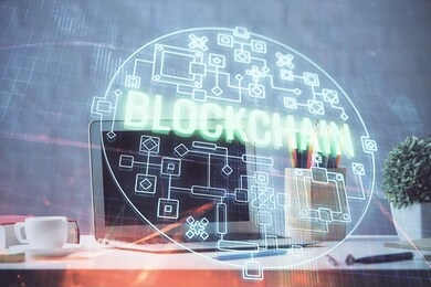 multi exposure of blockchain and crypto economy theme hologram and table with computer background. concept of bitcoin cryptocurrency.