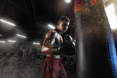 sport boxing man in dark gym