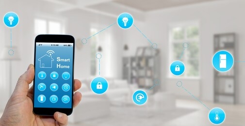 smart home concept, hand holding smartphone with smart home application on screen