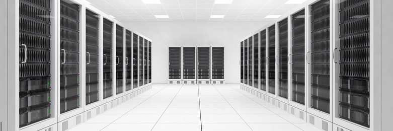 data center with two rows of computers in white room
