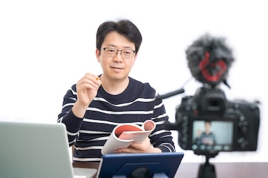 online learning concept. an asian middle-aged male teacher preparing to learn online.