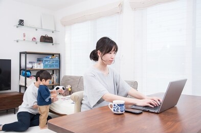 mother working in home living room