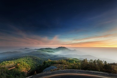 doi inthanon national park in the sunrise, mist and main road at chiang mai province, thailand
