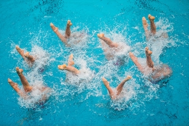 synchronized swimming competition in a large pool