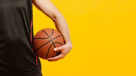 basketball player holding a ball