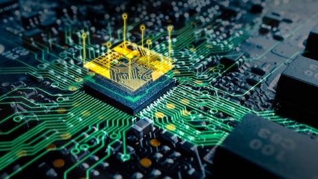 close-up macro shot of printed circuit board with computer motherboard component microchip with augmented reality graphics showing chip structure. inside of electronic device.
