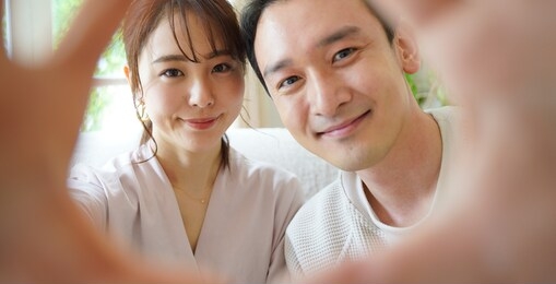 portrait of asian couple spending time in room