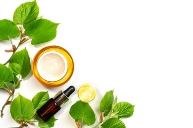 skin care products, natural cosmetic. flat lay image on white background natural cosmetic skincare bottle, serum and organic green leaf. homemade and beauty product concept.