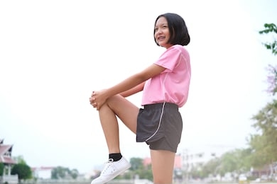 happy young asian girl doing sport at garden.