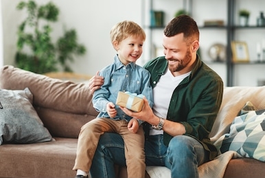 happy  family little son congratulates handsome dad for father's day! 
