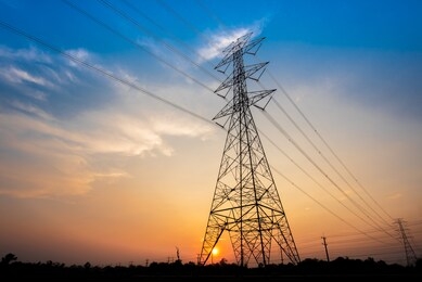 electric poles and lines at dusk or high voltage towers at beautiful sky
