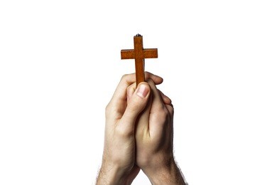 male hands holding wooden cross on white background