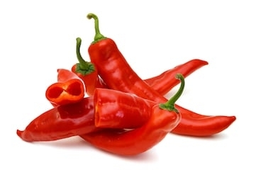 stack red chili peppers isolated on the white