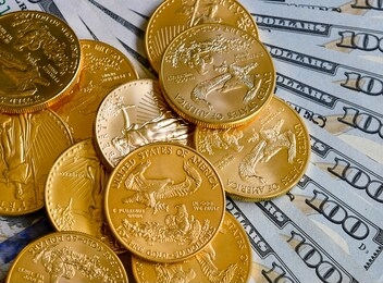 gold coins with us dollar currency notes