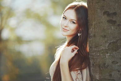 street fashion portrait of young woman with long hair