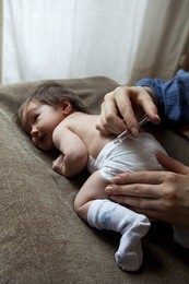 vaccinating a newborn baby