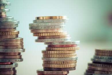coins stacked on each other, close up picture, market crisis and fragile market