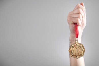 hand showing medal. sport, winner, success