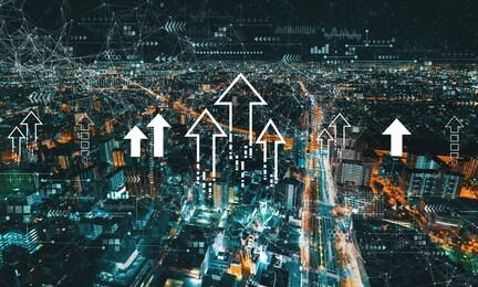 rising arrow theme with aerial cityscape view of japan at night
