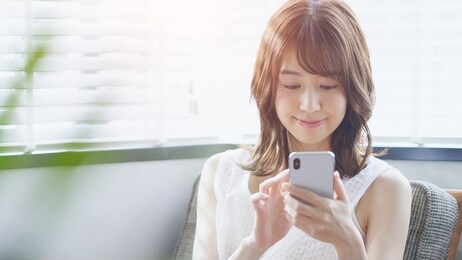young asian woman using a smart phone.