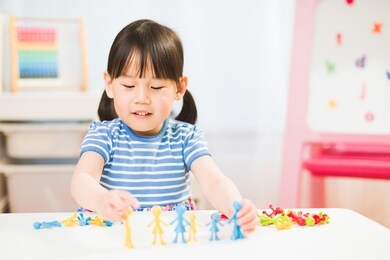 toddler girl learning counting and math for homeschooling