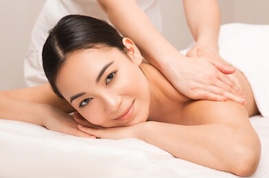 thai massage therapy. portrait asian woman enjoying massage at the spa.