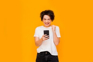 beautiful woman taking selfie at home. young cute girl talking via video link on a mobile phone with friends or relatives. happy woman using smartphone for video call friends and parents.