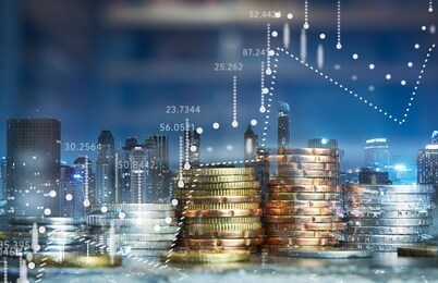 double exposure of coins stack with graph chart and night cityscape. economic, business, financial and stock market growth concept.