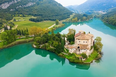 calavino, italy. toblino castle on a beautiful lake.