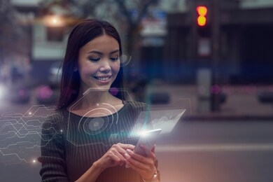 smart city data concept. a beautiful young asian woman is connected to a public digital network through her nod, mirrored as an augmented reality projection emerging from her phone.