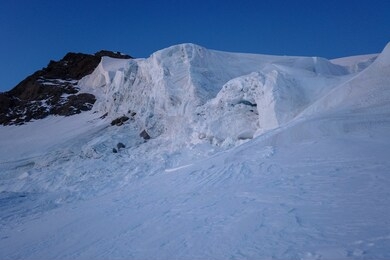 big snow pack with glacier crevasse on mont-blanc du tacul in the french alps, chamonix-mont-blanc, france