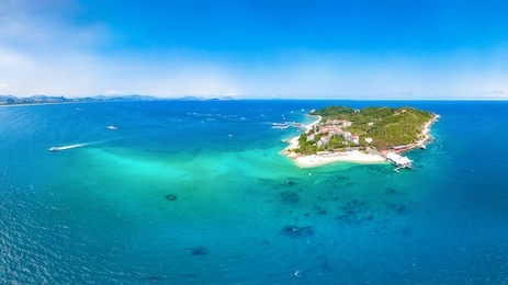 wuzhizhou island aerial view, a tropical island paradise with resort and recreational beach for sightseeing and water activities off the shore of haitang bay, sanya city, hainan province, china.