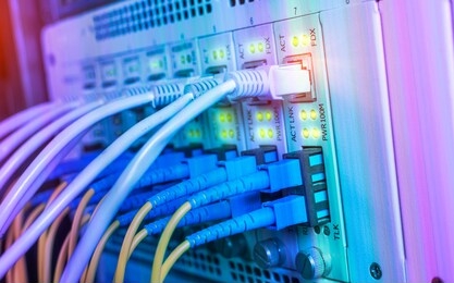 fiber optic cables connected to optic ports and utp and network cables connected to ethernet ports