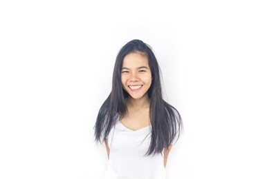 portrait of beautiful young asian woman tan skin in a white t-shirt with smile and happy feeling isolated on white background with copy space. fashion concept.