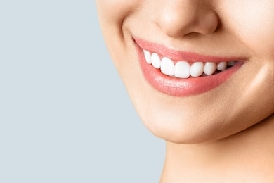 beautiful female smile after teeth whitening procedure. dental care. dentistry concept.