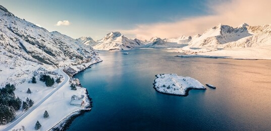 frosty morning view from flying drone of andopen fjord with kakernbrua bridge on background. beautiful winter seascape of norwegian sea, lofoten islands archipelago, norway, europe.