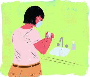 woman wearing medical mask washing her hands to prevent disease