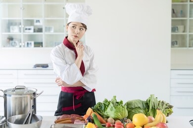 asian female chef in kitchen. cooking. restaurant.